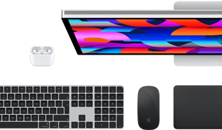 Mac accessories: AirPods, Studio Display, MagSafe cable, and Magic Keyboard with Touch ID, Magic Mouse, and Magic Trackpad all in Space Black